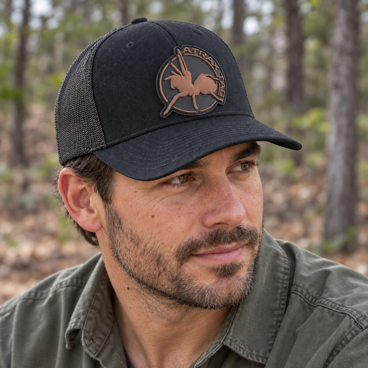 Black AtraxTac cap with brown logo worn by a man