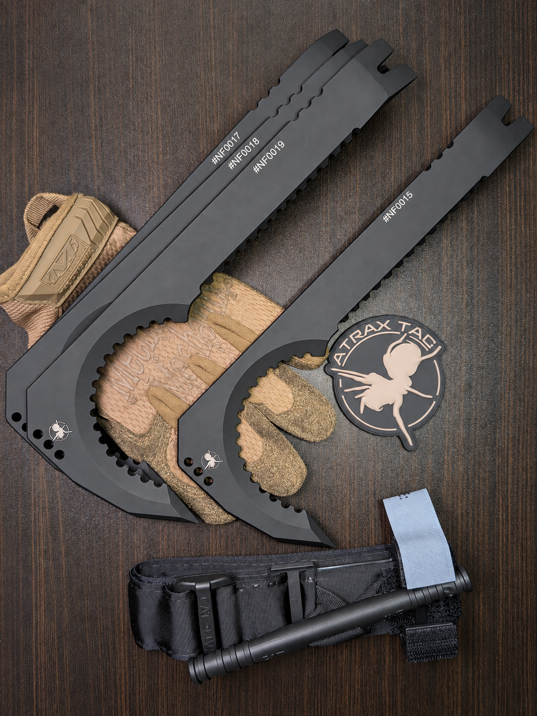 Atrax NFORCE in Armor Black Cerakote, original scene with tactical gloves, view 1