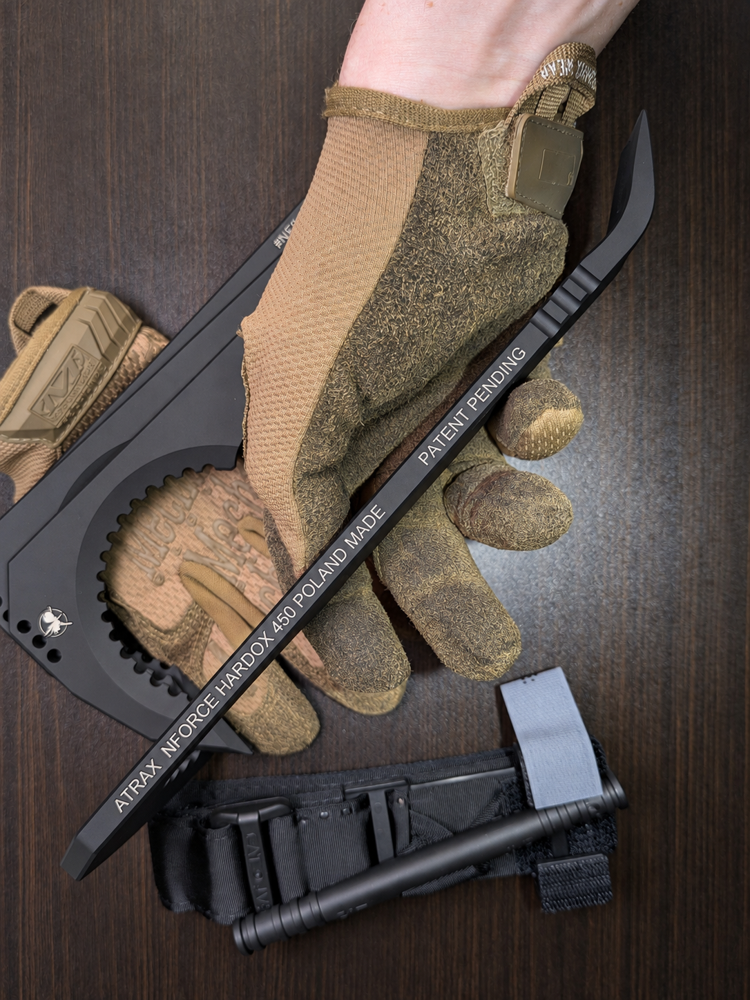 Atrax NFORCE in Armor Black Cerakote, original scene with tactical gloves, view 4