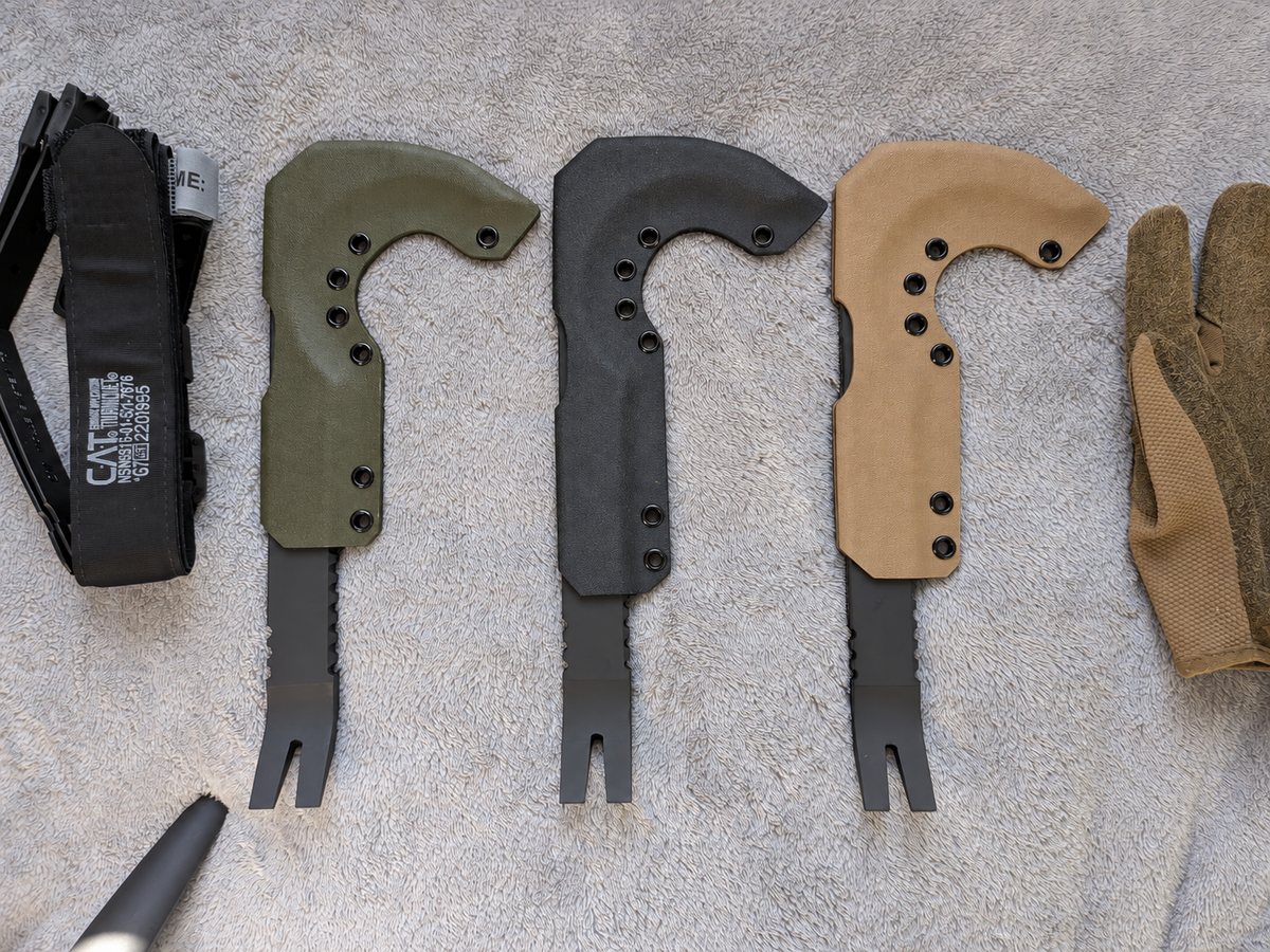 NFORCE tools with olive, black and FDE Kydex sheaths on the original fabric background