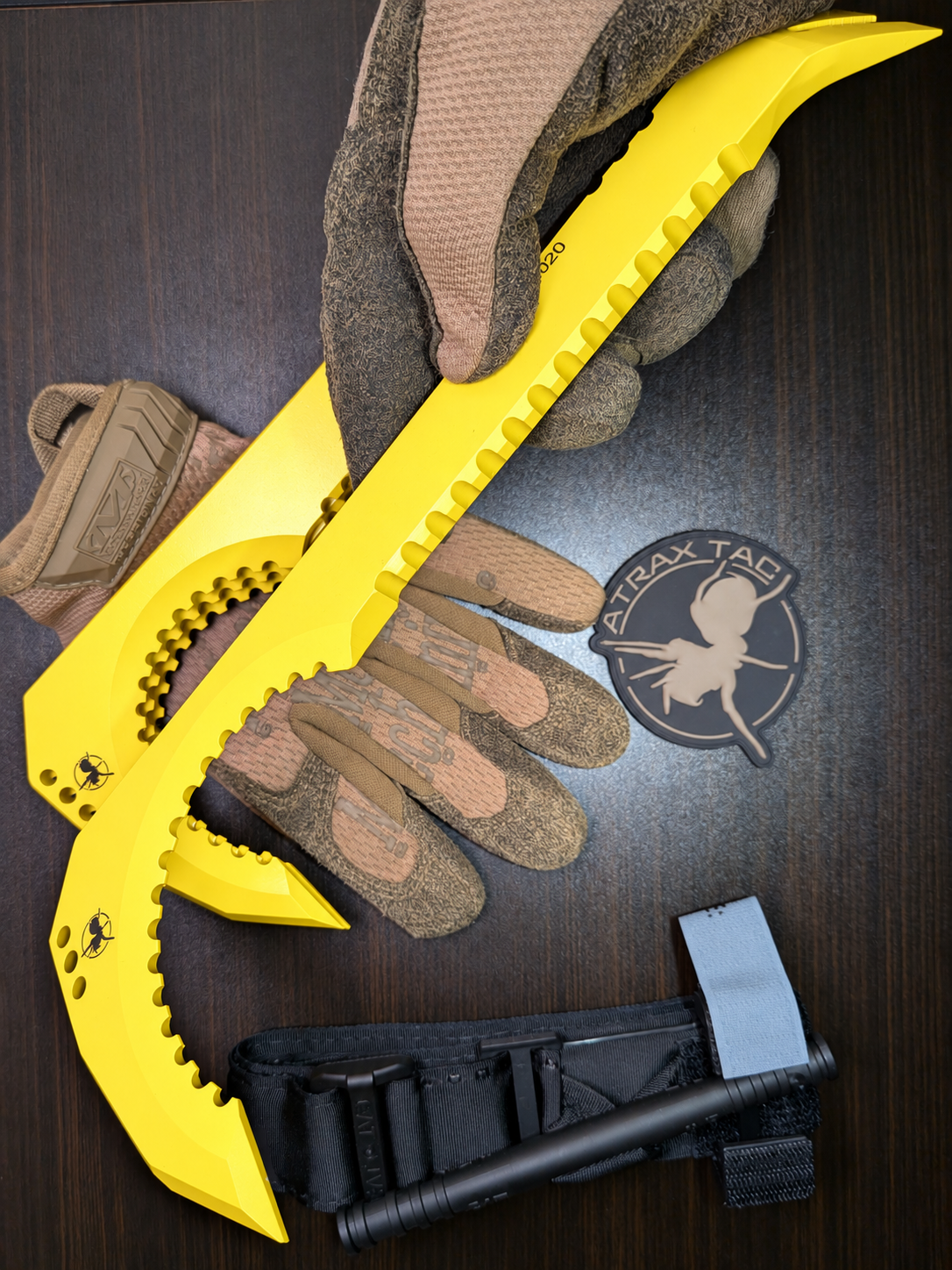 Atrax NFORCE in Lemon Zest Cerakote, original scene with tactical gloves, view 2