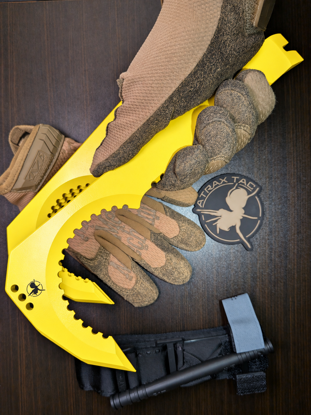 Atrax NFORCE in Lemon Zest Cerakote, original scene with tactical gloves, view 5