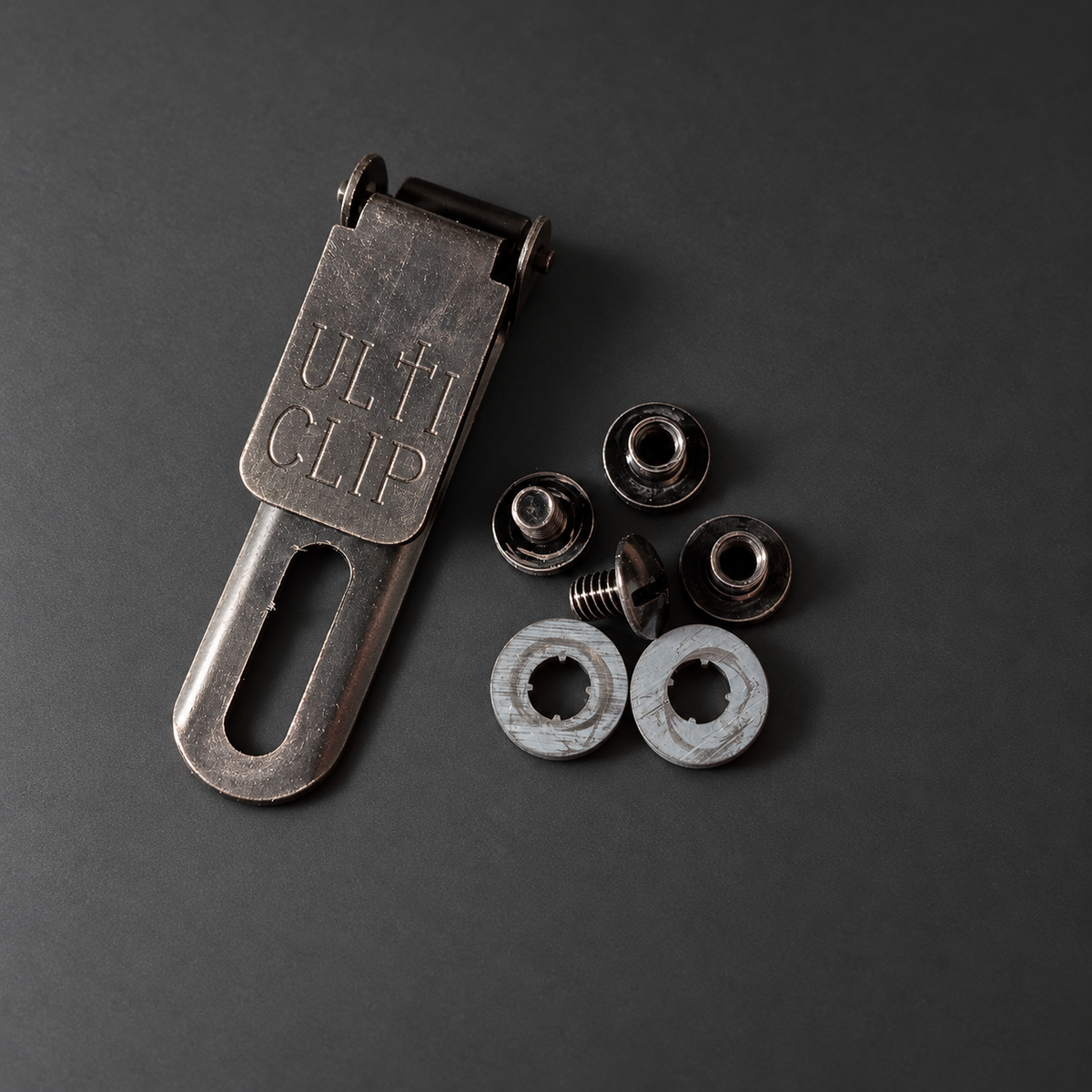 ULTICLIP SLIM 2.2 with mounting hardware on a graphite background