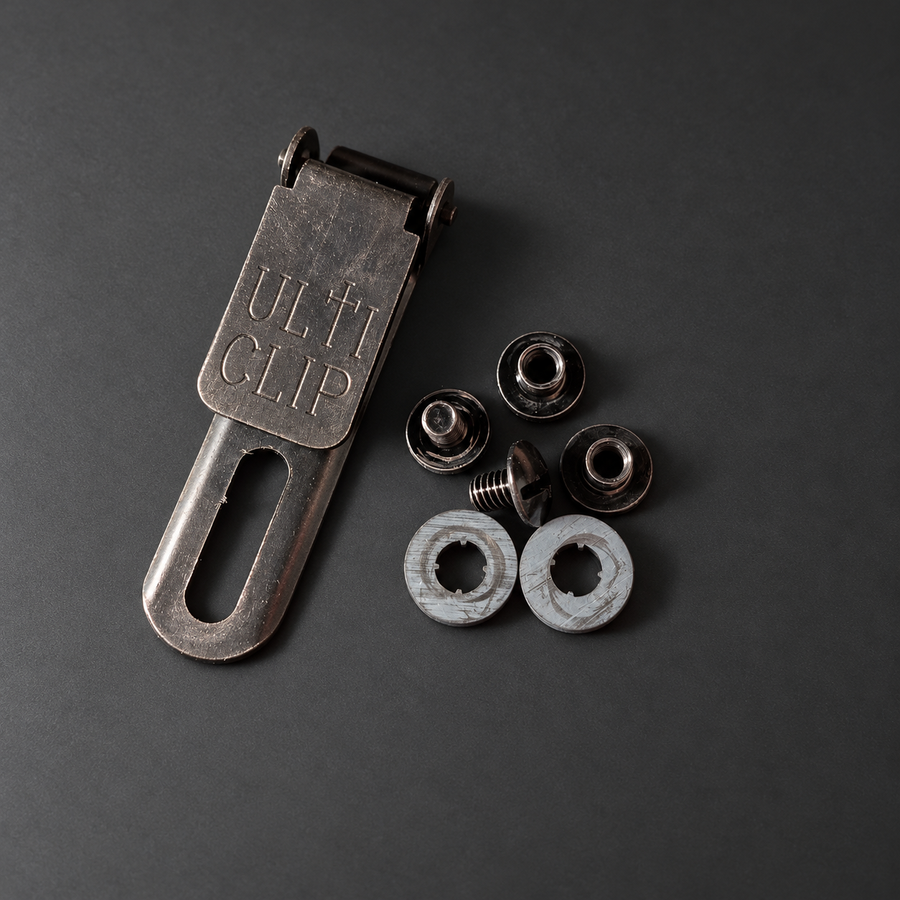 ULTICLIP SLIM 2.2 with mounting hardware on a graphite background
